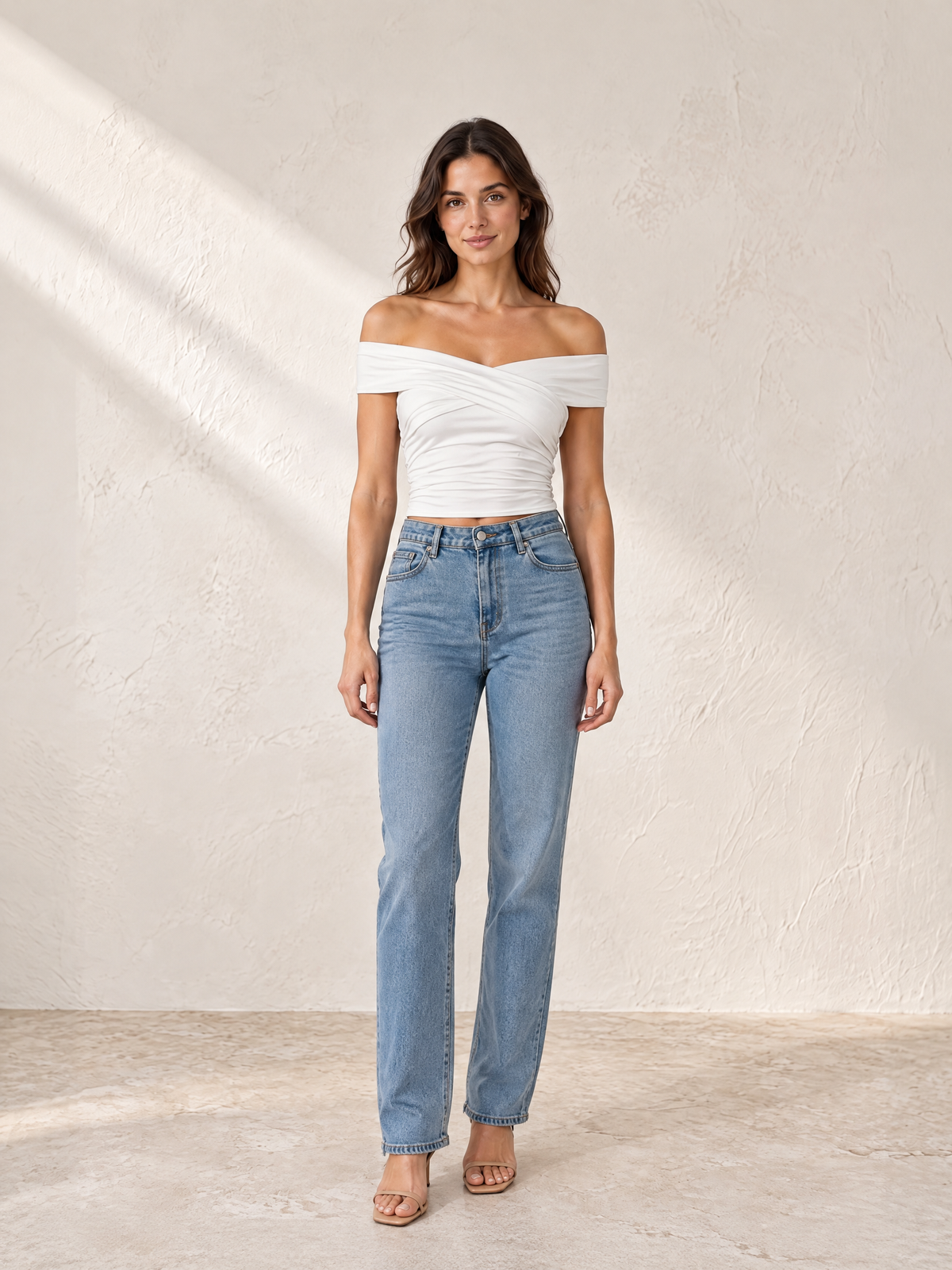 Noor Off-Shoulder Cross-Strap Ruched Top in white, full-length front view styled with jeans